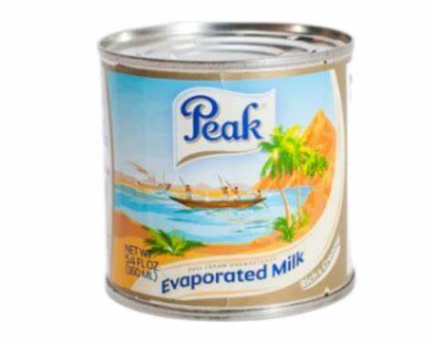 Peak Evaporated Milk 160ml can with tropical beach design and blue label