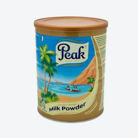Peak Evaporated Milk 900g tin with scenic label, ideal for culinary use.