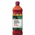 Bottle of Omni Red Palm Oil 1L with vibrant red color and label showcasing African cuisine heritage