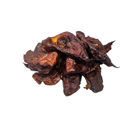 Smoked Asa Fish pieces with rich smoky aroma and savory flavor isolated on white background