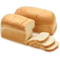 Agege Bread loaves with sliced pieces showing spongy texture.