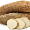 Fresh yam tubers piled together showcasing their creamy texture and earthy flavor